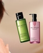 A graphic designed image featuring various cleansing oils including a La Roche-Posay foaming cleansing oil and a Kiehl’s Midnight Recovery cleansing oil.