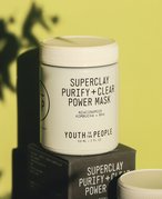 Youth to the People Superclay Purify + Clear Power Mask against a lime green background