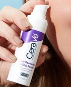 Close-up of person holding the CeraVe Skin Renewing Retinol Serum