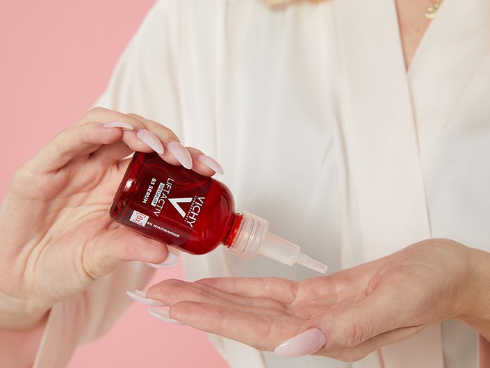Picture of an editor dropping the Vichy LiftActiv B3 Serum for Dark Spots & Wrinkles into her hand