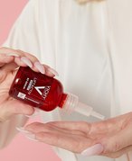 Picture of an editor dropping the Vichy LiftActiv B3 Serum for Dark Spots & Wrinkles into her hand