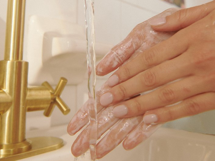 Photo of a person washing their hands 