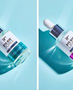 Side-by-side photos of the IT Cosmetics Bye Bye Pores Glycolic Acid Serum and IT Cosmetics Bye Bye Lines Hyaluronic Acid Serum on a light blue background