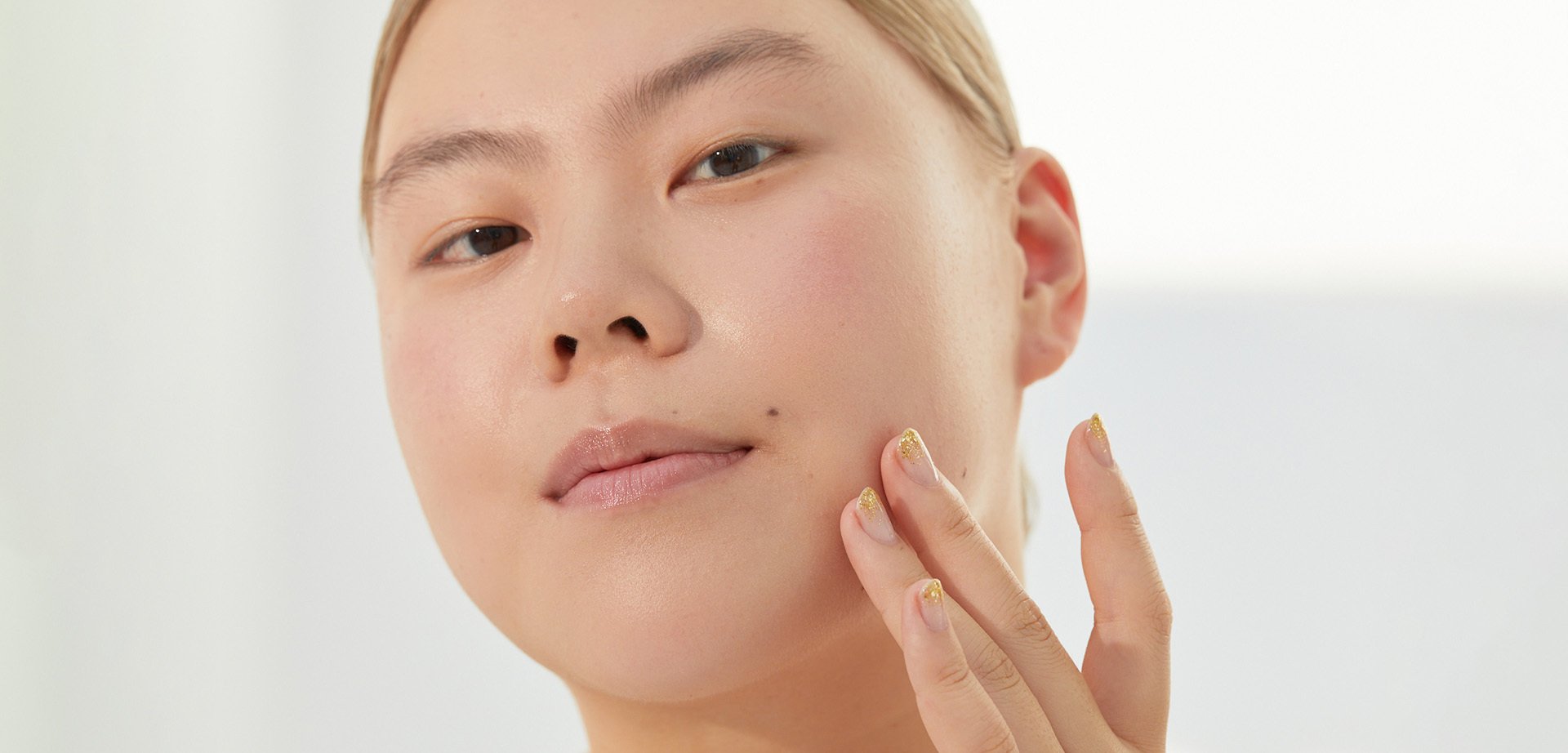 person touching their face