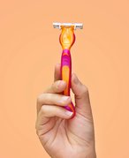 person holding shaving razor