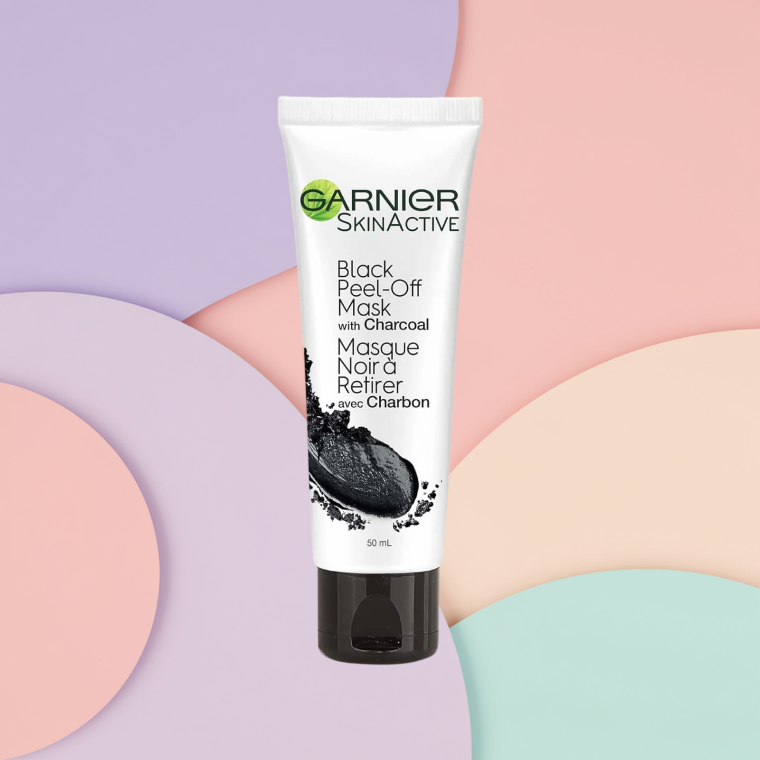 Bottle of Garnier SkinActive Peel Off Mask with Charcoal on a textured background